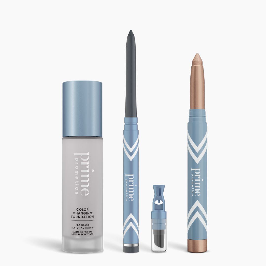 The All-Day Confidence Bundle by PrimePrometics™ features four blue and silver products: a color changing foundation, glide eyeliner pencil, eyebrow wand, and chunky eyeshadow stick.