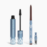 PrimePrometics™ Eye Upgrade Duo is displayed: a blue Volumizer mascara tube with wand and a Glide Eyeliner twist-up pencil, both featuring white chevron pattern accents and white text on a plain background.