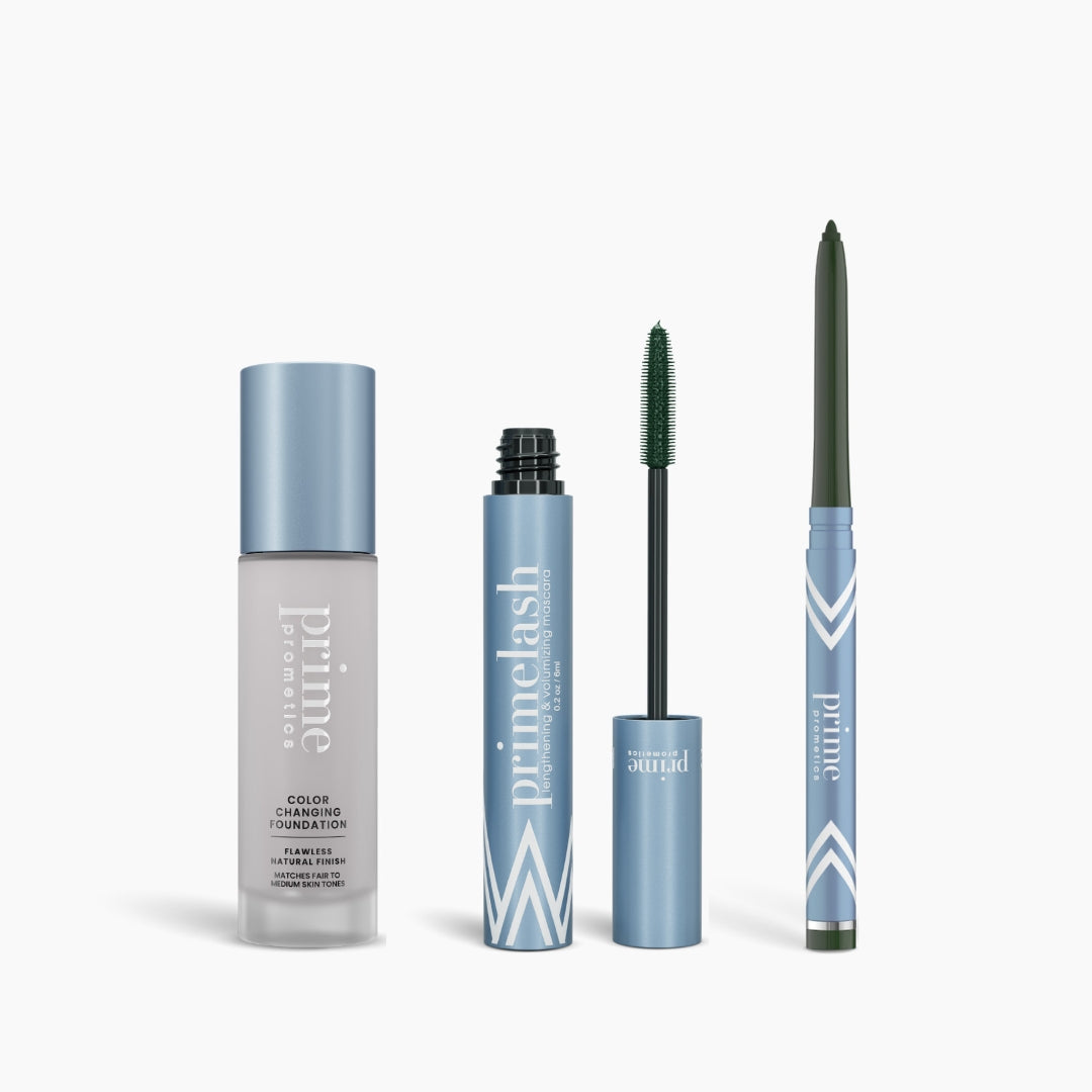 The PrimePrometics™ Prime Heroes Set includes a Color Changing Foundation (gray bottle), PrimeLash Mascara (blue tube, green wand), and PrimeEyes Glide eyeliner pencil, all with branding, displayed on a white background.