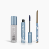 The PrimePrometics™ Prime Heroes Set features three makeup products in light blue and white packaging—Color Changing Foundation, PrimeLash Mascara with wand, and a PrimeEyes Glide eyebrow pencil—all standing upright on a white background.