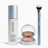 The PrimePrometics™ Face It, You're Flawless Set—featuring foundation, an open compact, and a concealer brush with white bristles and a blue handle—are arranged side by side on a white background.