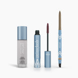 The PrimePrometics™ Prime Heroes Set includes three cosmetic products in blue and silver packaging: a Color Changing Foundation bottle, an open tube of PrimeLash Mascara, and a retractable brow pencil.