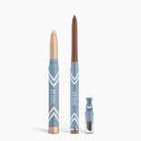 PrimePrometics™ Eye Lift Duo: a beige cream eyeshadow stick and a brown eyeliner for women over 50, plus a small clear sharpener—all in blue packaging, standing upright against a white background.