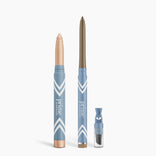 Three blue and gold PrimePrometics™ Eye Lift Duo items on a white background: an illuminating eye tint stick, a thinner eyeliner for women over 50, and a small cylindrical makeup sharpener.