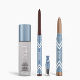 The PrimePrometics™ All-Day Confidence Bundle features four products: a color changing foundation, brown glide eyeliner pencil, brightener vial, and shimmery beige eyeshadow stick—all in blue and white packaging.
