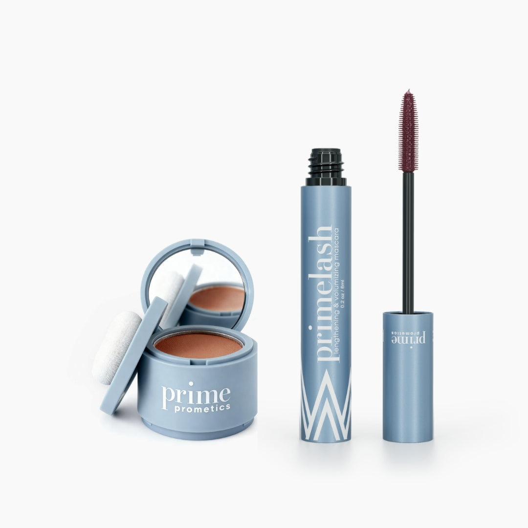 The Beauty Essentials set by PrimePrometics™ features a blue compact with powder and puff and an open blue PrimeLash mascara, both on a white background—ideal for touch-ups and bold lashes.
