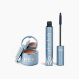 The PrimePrometics™ Beauty Essentials set includes a blue hairline powder compact with puff and mirror, and an open mascara tube—ideal for flawless hair touch-ups and defined lashes.