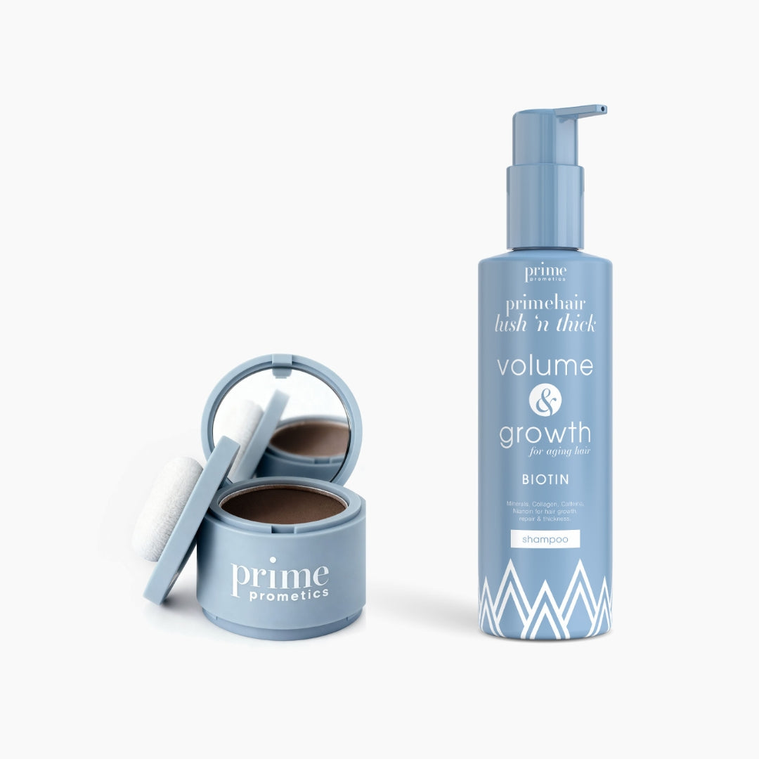 The Flawless Hair Set by PrimePrometics™ includes a round blue compact with mirror and puff, and a pump bottle labeled "primehair volume & growth shampoo with biotin," both displayed on a white background.