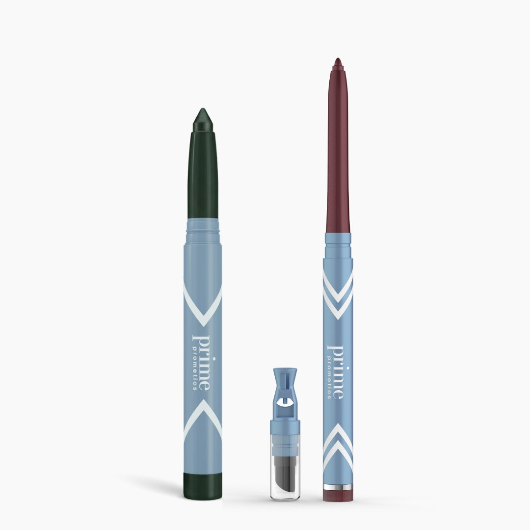 PrimePrometics™ Eye Lift Duo features two blue, water-resistant makeup pencils—one with a green tip and one with burgundy—plus a detachable sharpener and extra tip, all displayed on a white background. Ideal eyeliner for women over 50.