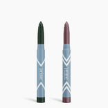The Complete Eye Sticks Kit by PrimePrometics™ features two makeup crayons—one with a dark green matte tip, the other in muted mauve—standing upright in light blue tubes against a white background for an eye-brightening touch.