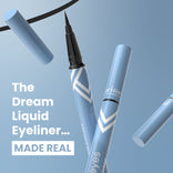 A set of 3 PrimePrometics™ PrimeEyes Liquid Eyeliner pens with black felt tips is displayed uncapped on a blue background. White text reads, "The Dream Liquid Eyeliner... MADE REAL," with several floating pens and caps.