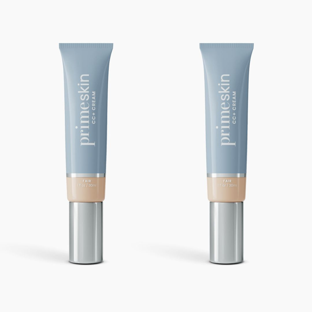 Two tubes of PrimePrometics™ 2pcs PrimeSkin CC+ Cream in Fair stand upright on a white background. The blue tubes with silver caps and beige labels display the product name and shade, highlighting this lightweight, pore-blurring foundation.