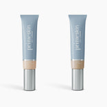 Two upright blue tubes of PrimePrometics™ 2pcs PrimeSkin CC+ Cream, labeled Fair and Light, feature silver caps and beige labels. This lightweight foundation blurs pores on a light background.