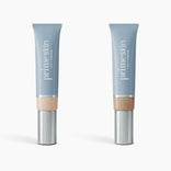 Two tubes of PrimePrometics™ 2pcs PrimeSkin CC+ Cream, a lightweight pore-blurring foundation, are shown against a white background—one in Fair and one in Medium—with light blue bodies, silver caps, and beige bases for each shade.