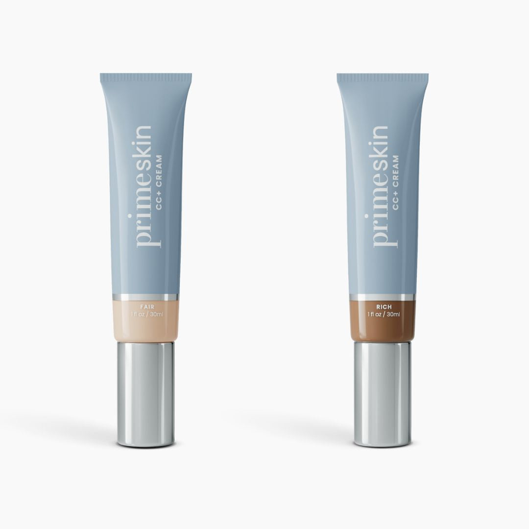 Two blue tubes of 2pcs PrimeSkin CC+ Cream by PrimePrometics™ stand upright, labeled Fair and Rich. This lightweight foundation for women over 50 blurs pores and comes in 1 fl oz (30 ml) sizes with sleek silver caps against a white background.
