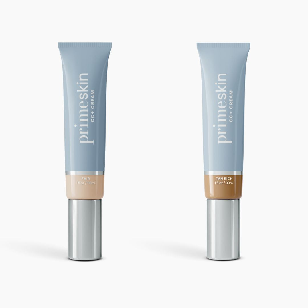 Two upright tubes of PrimePrometics™ 2pcs PrimeSkin CC+ Cream (1 fl oz/30ml each) in Fair and Tan Rich shades are shown against a white background. This lightweight foundation visibly blurs pores.