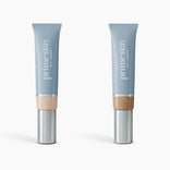 Two tubes of PrimePrometics™ 2pcs PrimeSkin CC+ Cream in Fair and Tan are shown on a white background. The light blue and silver packaging offers foundations for women over 50, visibly blurring pores for a flawless finish.