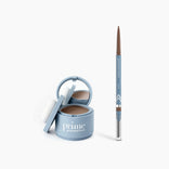 The PrimePrometics™ Instant Confidence Duo—a blue compact with mirror and applicator, plus a matching blue brow pencil with spoolie—rests on a white background.