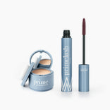 The Beauty Essentials Set by PrimePrometics™ features two blue makeup products—a Hairline Powder compact with mirror and sponge, and an open tube of PrimeLash Mascara with wand—displayed on a white background.