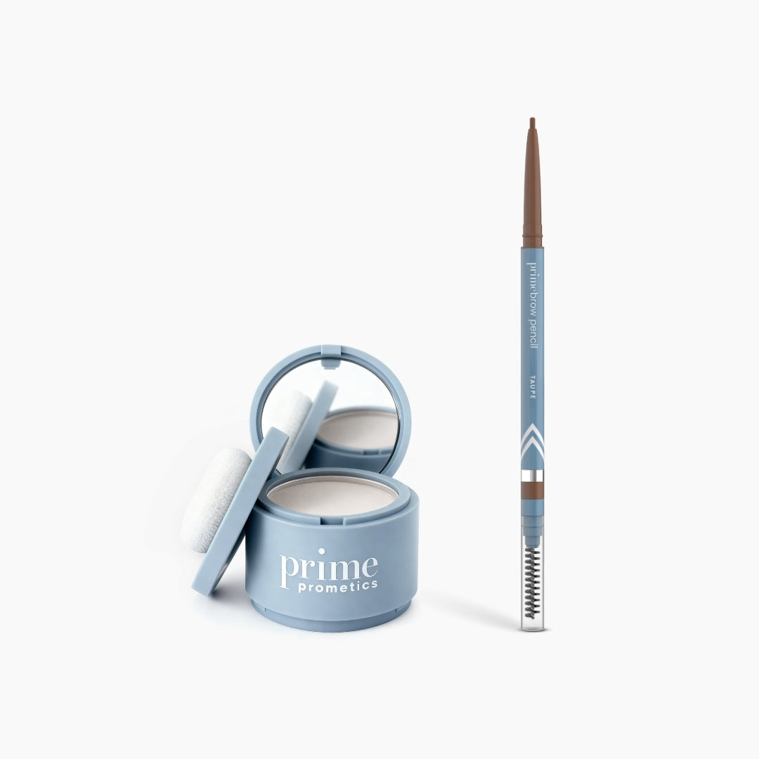 The PrimePrometics™ Instant Confidence Duo includes a blue compact Hairline Powder with mirror and puff, alongside a matching PrimeBrow Pencil with spoolie brush, both providing instant coverage on a white background.