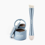 An open blue Hairline Perfection Kit by PrimePrometics™—featuring a built-in mirror, cushion applicator, and the PrimePrometics™ label—sits beside a double-ended blue brush with bristles on one side and a sponge tip on the other, ideal for precise hairline powder application and flawless gray coverage.