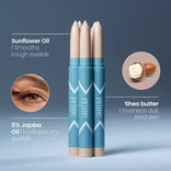 Three blue eye primer sticks are shown upright against a blue background. Beside them are close-ups of an eye and ingredients: sunflower oil, shea butter, and 5% jojoba oil with benefits listed.