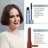 A woman with a short brown bob and pearl necklace is shown beside two PrimePrometics™ products from the Instant Red Carpet Look Set: a mascara and Cherry Noir lipstick, noted for their lash-lifting and hydrating, tinted results.