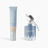 The Prep & Prime Bundle by PrimePrometics™ features two blue skincare essentials on a white background, including a tube and a glass dropper bottle with the serum dispensing a single drop.