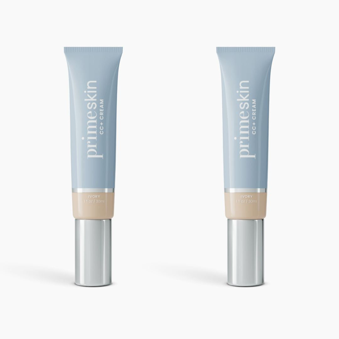 Two tubes of PrimePrometics™ 2pcs PrimeSkin CC+ Cream in ivory stand upright against a white background. The light blue tubes with silver caps blur pores, making them an ideal lightweight foundation for women over 50.