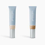 Two upright tubes of PrimePrometics™ 2pcs PrimeSkin CC+ Cream are displayed—Ivory on the left and Tan Rich on the right—in light blue packaging with silver caps and white text, designed to blur pores with a lightweight formula.