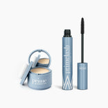 The Beauty Essentials set by PrimePrometics™ includes a blue compact with mirror and puff for hairline powder or concealer, and an open tube of PrimeLash mascara. Both are displayed on a white background.