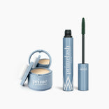The PrimePrometics™ Beauty Essentials set features a light blue compact for hairline powder or makeup and a tube of mascara with its wand, both displayed on a white background.