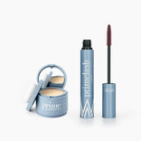 The Beauty Essentials set from PrimePrometics™ features three blue cosmetic products—a hairline powder compact, a closed tube, and an open PrimeLash mascara—all labeled on a white background.