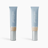 Two blue 1 fl oz (30ml) tubes of PrimePrometics™ 2pcs PrimeSkin CC+ Cream, labeled Light and Ivory, with silver caps are shown on a white background. This lightweight foundation is ideal for women over 50.
