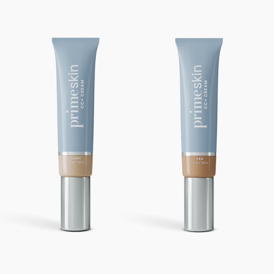 Two tubes of 2pcs PrimeSkin CC+ Cream by PrimePrometics™—one in Light, the other in Tan—stand upright in sleek blue packaging with silver caps and beige bases against a white background.