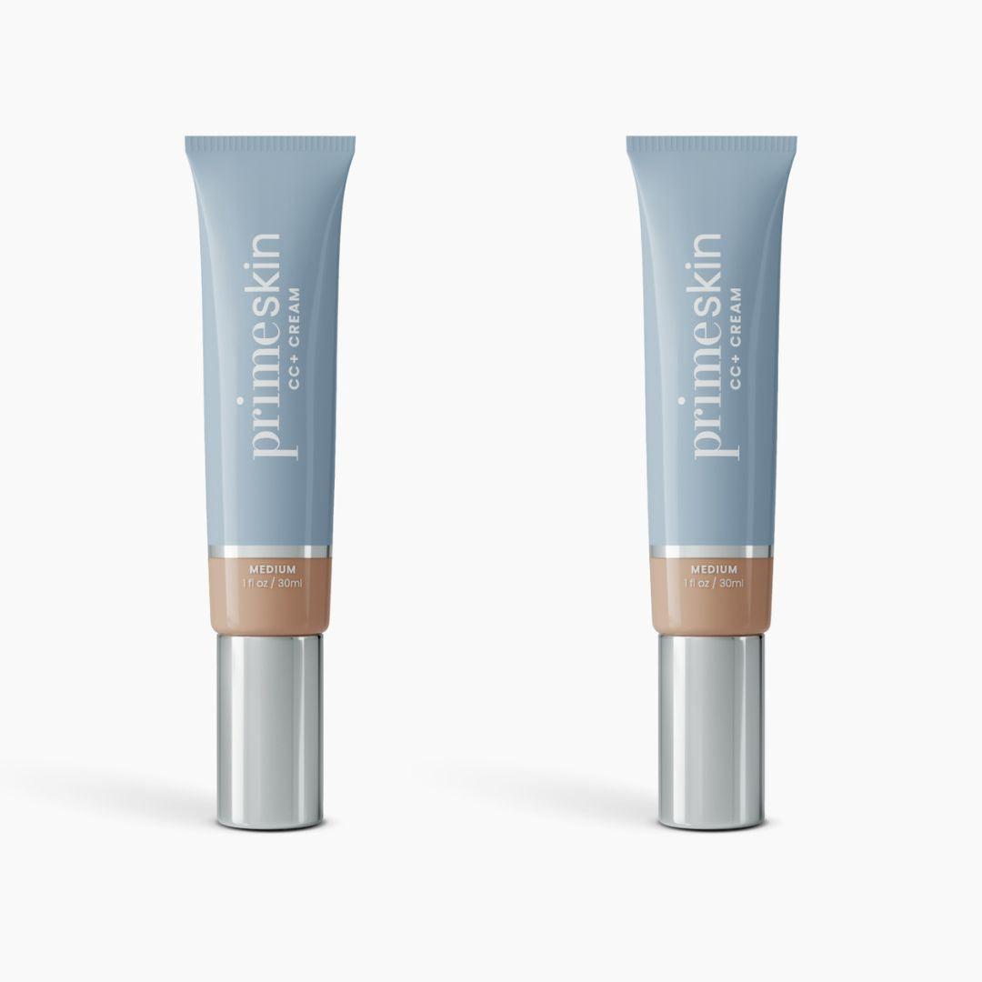 Two 2pcs PrimeSkin CC+ Cream by PrimePrometics™, in medium shade with blue caps and silver pumps, are displayed upright on a white background. This lightweight foundation blurs pores and enhances your natural look.