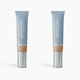 Two 2pcs PrimeSkin CC+ Cream by PrimePrometics™, in medium shade with blue caps and silver pumps, are displayed upright on a white background. This lightweight foundation blurs pores and enhances your natural look.