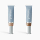 Two light blue 1oz tubes of PrimePrometics™ 2pcs PrimeSkin CC+ Cream, in Medium and Rich shades, with silver caps, displayed on white. This lightweight foundation blurs pores—ideal for women over 50.