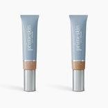 Two upright tubes of PrimePrometics™ 2pcs PrimeSkin CC+ Cream (Medium and Tan) stand on a white background. Each blue tube with a silver cap holds 1 fl oz (30 ml) of lightweight, pore-blurring foundation.