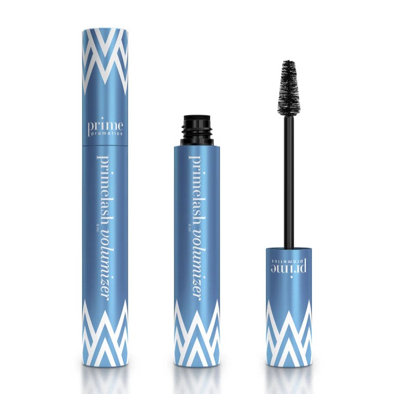 A blue tube of Prime Prometics primelash volumizer mascara, shown closed, open with the cap off, and with the mascara wand displaying black bristles. White chevron patterns decorate the packaging.