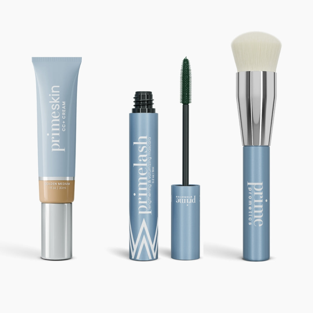The Effortless Beauty Complete Bundle by PrimePrometics™ features four blue and silver products: a tube of CC+ Cream, an open mascara with black wand, a closed mascara tube, and a Foundation Brush with white bristles.