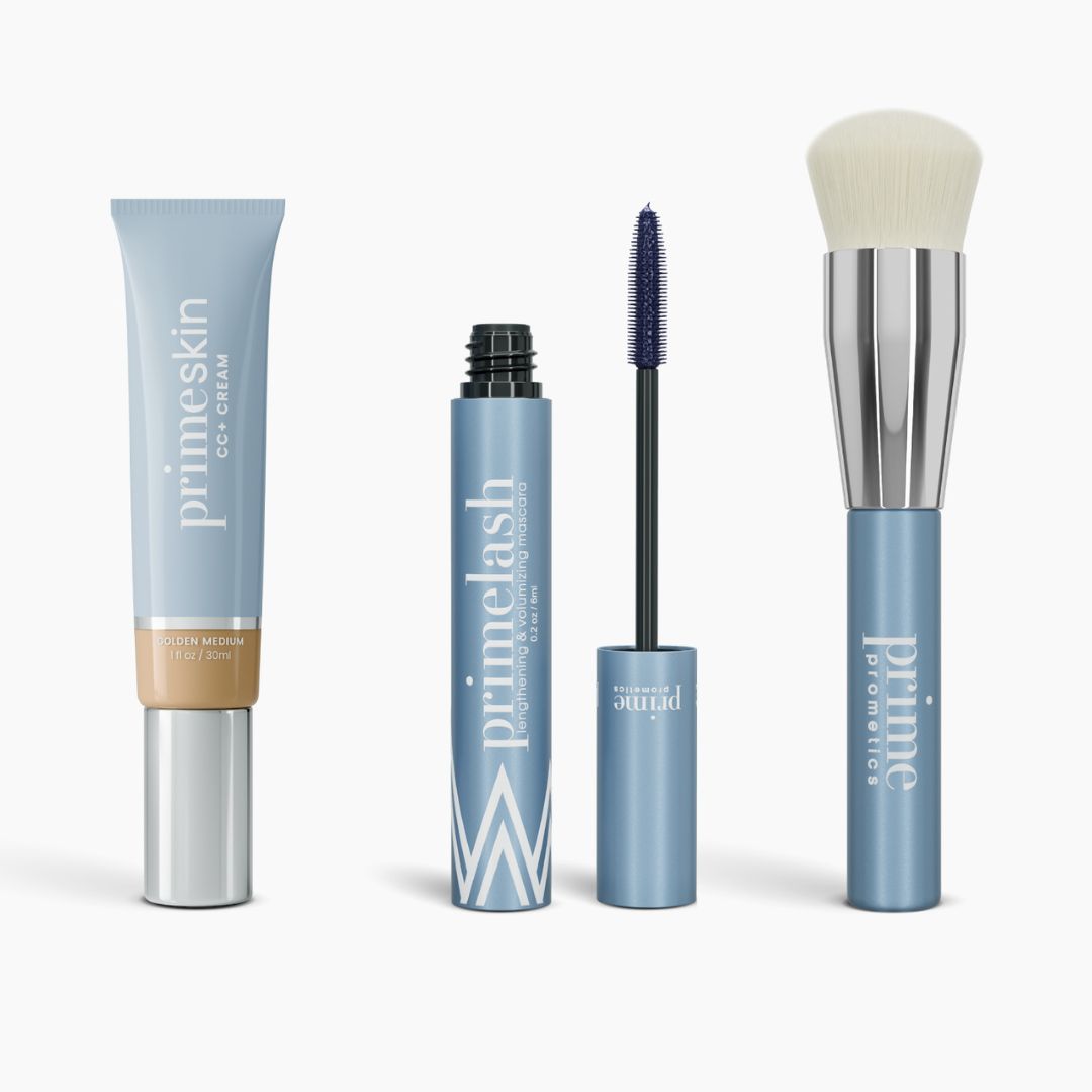 The Effortless Beauty Complete Bundle by PrimePrometics™ features a primeskin CC+ Cream, primelash mascara with wand, primer stick, and a foundation brush with silver handle—all in sleek light blue packaging.