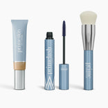 The Effortless Beauty Complete Bundle by PrimePrometics™ features a primeskin CC+ Cream, primelash mascara with wand, primer stick, and a foundation brush with silver handle—all in sleek light blue packaging.