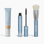 Four PrimePrometics™ Effortless Beauty Complete Bundle products—a CC+ Cream, mascara with wand, primer, and foundation brush—are arranged in a row, all featuring sleek light blue packaging.