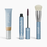 The Effortless Beauty Complete Bundle by PrimePrometics™ features a blue tube of CC+ Cream, an open blue Mascara, and a fluffy Foundation Brush with a metallic handle, all upright on a white background.