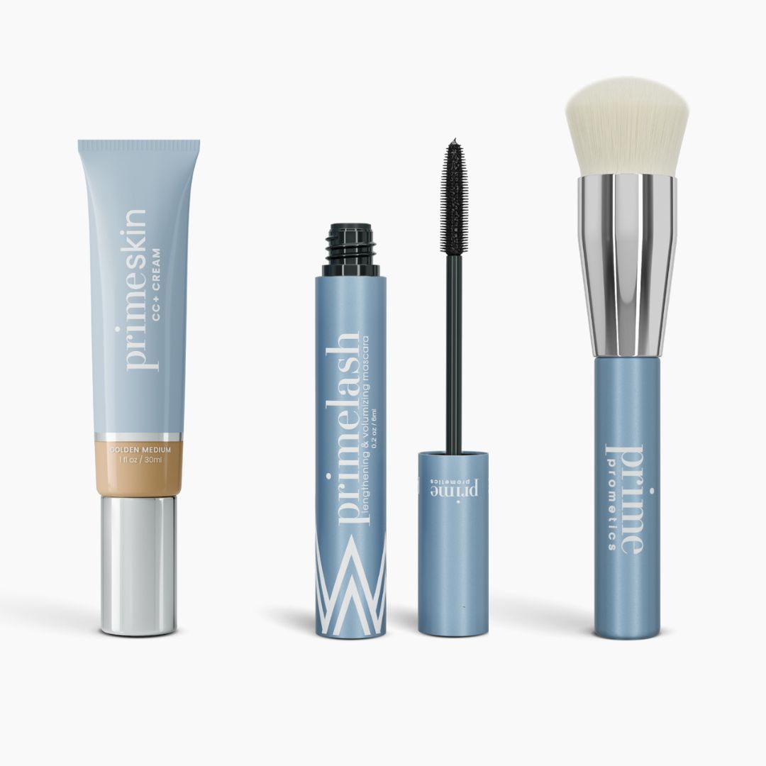 The Effortless Beauty Complete Bundle by PrimePrometics™ features four light blue products: CC+ Cream, open Mascara with wand, Primer tube, and Foundation Brush with a silver ferrule and white bristles.