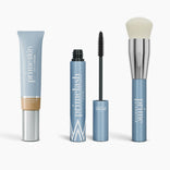 The Effortless Beauty Complete Bundle by PrimePrometics™ features four light blue products: CC+ Cream, open Mascara with wand, Primer tube, and Foundation Brush with a silver ferrule and white bristles.