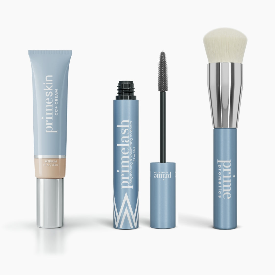The Effortless Beauty Complete Bundle by PrimePrometics™ features four blue and silver products: a CC+ Cream tube, open Mascara with wand, closed Mascara tube, and a Foundation Brush with a round fluffy white head.