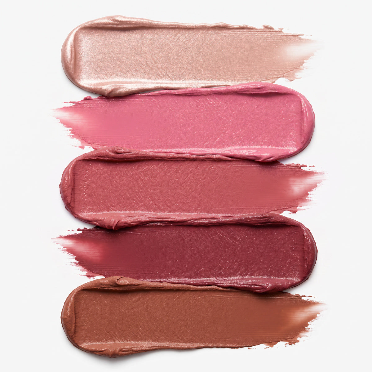 Auf weißem Hintergrund sind fünf horizontale Striche mit dem cremigen PrimePrometics™ PrimeWands 5-in-1-Make-up-Stift in abgestuften Nude-, Rosa-, Mauve- und Brauntönen zu sehen. Die mit Hautpflegewirkstoffen angereicherte Formel lässt sich geschmeidig auftragen und sorgt für eine aufbaubare, individuell anpassbare Deckkraft.