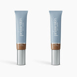 Two identical PrimePrometics™ 2pcs PrimeSkin CC+ Cream tubes, with blue caps, light blue bodies, and silver bottoms, stand upright on white—a lightweight foundation that blurs pores, perfect for women over 50.
